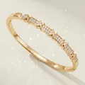Elegant gold-plated bangle featuring unique crisscross X motifs and sparkling clear stones. - Stylish Everyday Versatile Bracelet Bs-j5584g