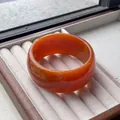 Vintage orange wide resin bangle with smooth rounded finish and translucent amber texture - Brown Orange