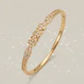 Elegant 18K gold plated copper flower bangle with sparkling cubic zirconia accents - Gold Celebration Bangle BS-J5635G