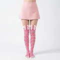 Pink and white striped over-the-knee stockings with cute bows and strawberry accents - Pink White Striped Thigh High Socks with Strawberry Bow