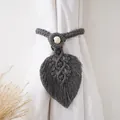 Detailed view of a grey handmade macrame curtain tieback with leaf shape and wooden bead - Style B Woven Pattern / Gray