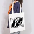 Stylish white canvas tote bag for women featuring a bold black Jesus Is King graphic print - JESUS IS KING Frame Style (19)