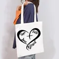 Close-up of a white canvas tote bag with heart-shaped Hope Love Faith Blessed print - Hope Love Faith Blessed Style (12)