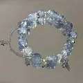 Close-up of blue ice-crackle beaded bracelet with silver star and cross charms. - Blue Ice Crack Cross Style (S431)