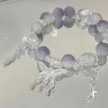 Elegant purple and clear bead bracelet featuring a detailed silver butterfly charm. - S426