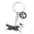 Kreativer Schlüsselanhänger aus Metall mit Border Collie und schwarz-weißer Pfote für Hunde - M10188 Border Collie Läufer