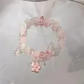 Handmade beaded bracelet with pink crystal beads and a cherry blossom charm - Pink and White Ice Crack Cherry Blossom Style (S504)