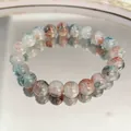 Elegant beaded bracelet featuring artistic ink-painted patterns displayed on a clear mirror - Blue and Gray Ink Cracked Bead Style (S610)