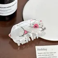 Close-up of white acrylic hair claw clip featuring a cute cartoon polar bear design - Polar Bear