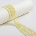 Close-up of premium faceted zircon loose beads for DIY bracelet and necklace making - 4mm / Light Yellow
