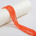 Close-up of faceted orange zircon beads for DIY jewelry making accessories - 4mm / Orange