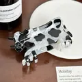 Cute acrylic cow-shaped hair claw clip with black and white animal print pattern design - Cow