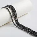 Close-up of black faceted zircon beads showing sparkling cut textures for jewelry making - 4mm / Black