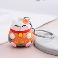 Adorable llavero de gato de la suerte Maneki-neko naranja para colgar en bolsos - Naranja