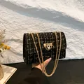 Elegant black and gold checkered tweed chain shoulder bag with decorative metal buckle - Tweed Black