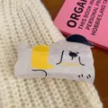 Cute white puppy acrylic hair claw clip with yellow accent and black hat design - Dog with Black Hat and Yellow Clothes