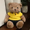 Simpatico orsetto di peluche con polo gialla e dettaglio del colletto a quadri - Orso Cammello in Abiti Gialli / 20-30cm