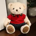 Simpatico orsetto di peluche color crema con polo rossa e pantaloni blu a righe - Orsetto Bianco in Abiti Rossi / 20-30cm