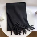 Cozy thick black plush scarf with long tassels for winter warmth and style. - Black