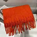 Cozy thick orange winter scarf featuring long tassels and soft cashmere-like texture for women - Red