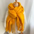 Premium thick vibrant yellow fringe scarf providing winter warmth with soft plush texture - Turmeric
