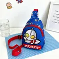 Detailed view of blue children's cartoon chest bag with superhero print and red strap - Blue Flying Man / 13*6*18