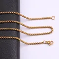 Macro view of a gold-plated titanium steel box chain necklace with a lobster clasp - 45cm / 2mm / Gold