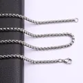Detailed macro view of a durable silver titanium steel box chain with lobster clasp - 45cm / 2mm / Steel