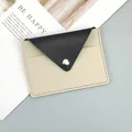 Slim minimalist color-block faux leather card holder with snap closure in black and beige - Black