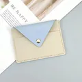 Slim minimalist women's cardholder and coin purse in light blue and cream colors. - Light Blue