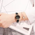 Elegant women's quartz watch with black leather strap and rose gold calendar dial. - Leather Strap Black Dial