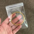 High quality clear PVC self-sealing jewelry storage bag with gold bangle shown inside. - 8*12-26 Microns Non-perforated [100 Pieces] - Limited-time Price Reduction
