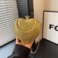 Luxury golden heart-shaped evening clutch bag with sparkling texture and gold chain - Gold
