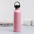 Matte pink stainless steel vacuum insulated water bottle with a black flexible handle - Nordic Pink
