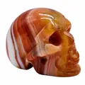 Exquisite 2-inch natural banded agate carved skull figurine with orange and white patterns - Red Stripe Agate / 2 Inches