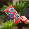 Ethnic style red canvas long wallet with floral embroidery and wrist strap - Red
