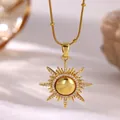 Close-up of sunburst pendant necklace with 18K gold plating and micro-paved zircons - Gold Sun Starburst (G4288027)