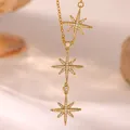 Macro detail of 18K gold plated copper necklace featuring triple starburst pendants - Triple Starburst Pendant (G4188034)