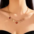 Detail view of a charming gold necklace with strawberry and butterfly pendants on model - Strawberry Daisy Butterfly Key Ladybug Pendant (6131032174377) / #7