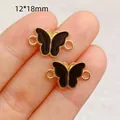 Detailed view of butterfly charms for jewelry making, 12x18mm size shown on fingers. - Butterfly Shape (6100289847349)