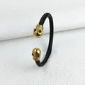Gothic zwarte gedraaide touwarmband met twee gouden doodshoofden - Zwart & Goud