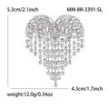 Elegant silver heart tassel brooch with shimmering rhinestones and weight details - White (White K-3391-SL)