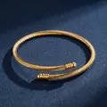 Elegant women's gold-plated stainless steel twisted wire bangle with sleek ball ends. - Twisted Steel Wire Open Bracelet / Gold (44乙-D-10)