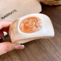 Elegant vintage resin marbled round bangle featuring a unique orange swirl detail - White with Orange-Gold Marbling