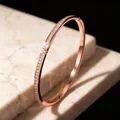 Elegant rose gold starry sky bangle with pavé crystals in a light luxury fashion style. - Rose Gold Zirconia