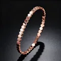 Elegant rose gold honeycomb hexagonal bangle crafted from titanium steel for women. - Honeycomb Bangle (Rose Gold)