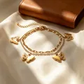 Bracciale a doppio strato in acciaio inossidabile dorato con ciondoli a farfalla traforati - Stile Oro (C9163)