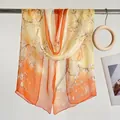 Elegant long silk scarf for women featuring a lotus floral print in yellow and orange - Plum Mountain Orange / 160cm