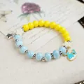 Handmade Jingdezhen ceramic beaded bracelet featuring a blue whale charm and stars - Whale Fall Whispers (1821-02) / Sky Blue