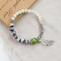 Artistic handmade ceramic beaded bracelet with vintage butterfly and wing silver charms - Xianyule (1800-01) / Blue and Purple